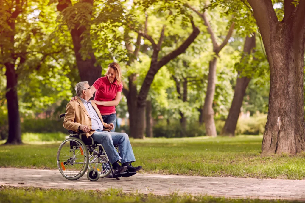 Home care aide in Braintree, MA helping man on wheelchair